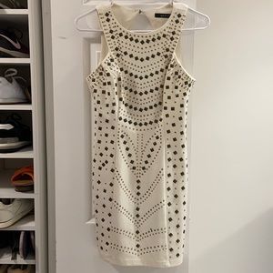 Little white mini dress with metalic details